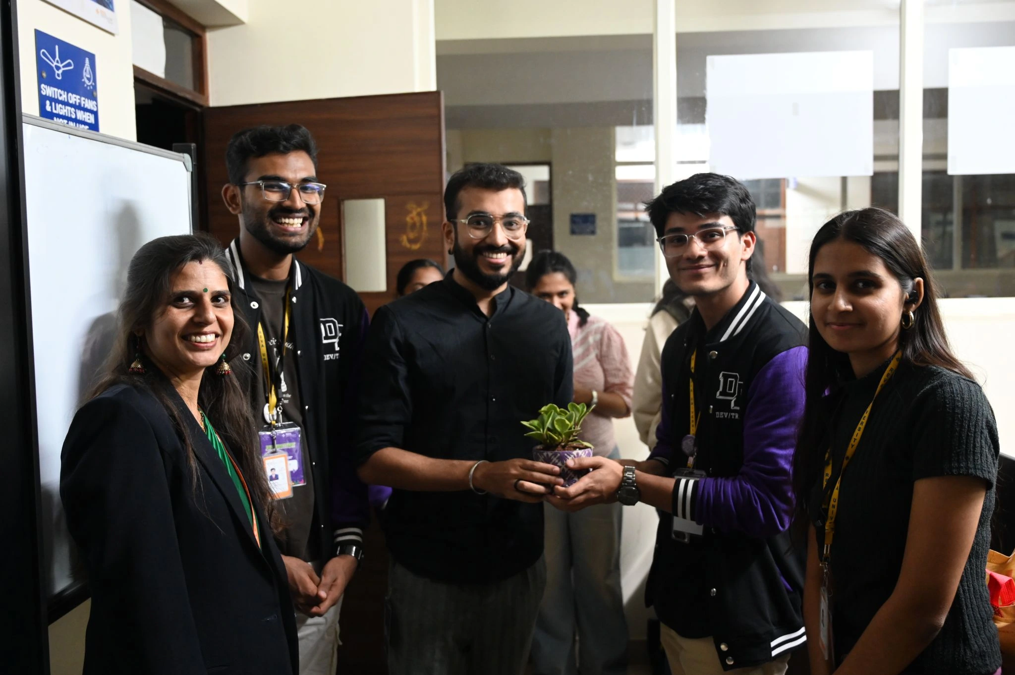 A group photograph from the REVA University UX design hackathon.
